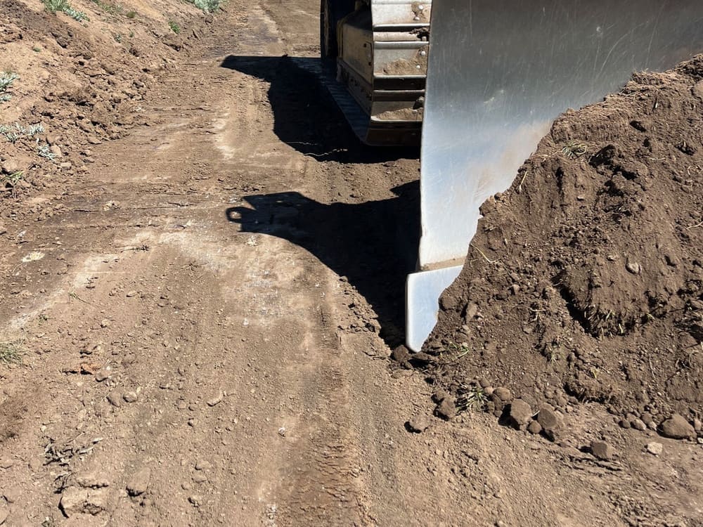 Cutting subgrade for concrete while sifting out old fabric