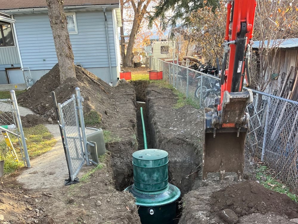 Septic tank and riser set in a tight backyard