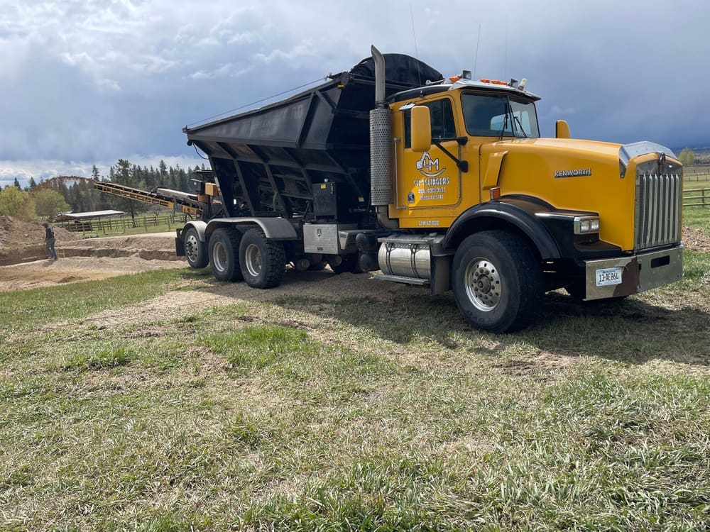 Slinger truck on site for gravel placement