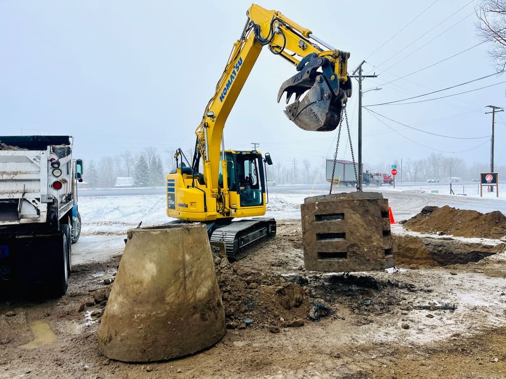 Drainage sump for a Lolo parking lot that was having flooding issues. We repaired the drain bed, re-compacted the backfill and graded the parking lot.