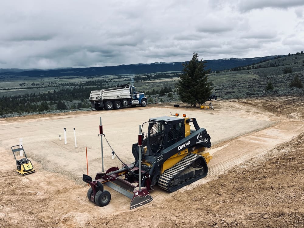 Laser-guided grading on a building pad