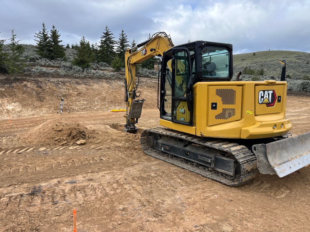 Excavator cutting a building pad